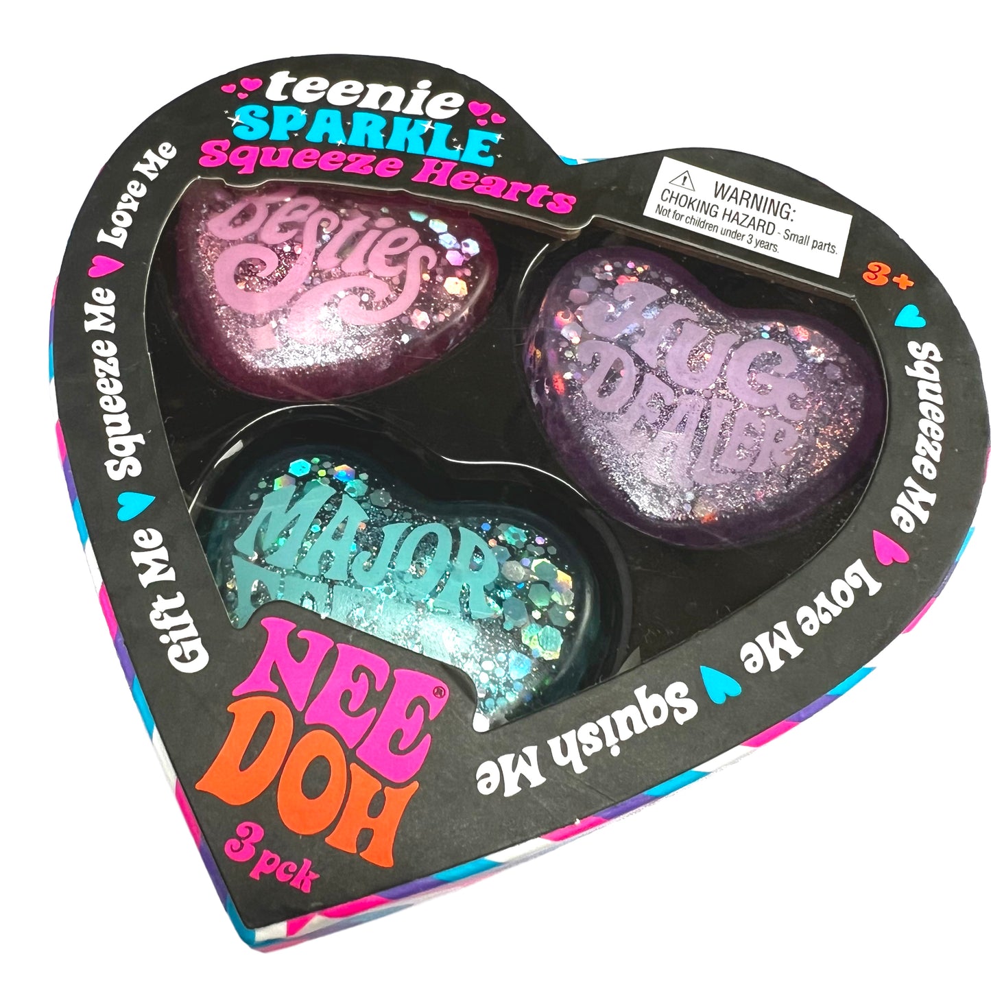 Heart-shaped packaging of 'teenie SPARKLE Squeeze Hearts' with colorful text and glittery hearts.