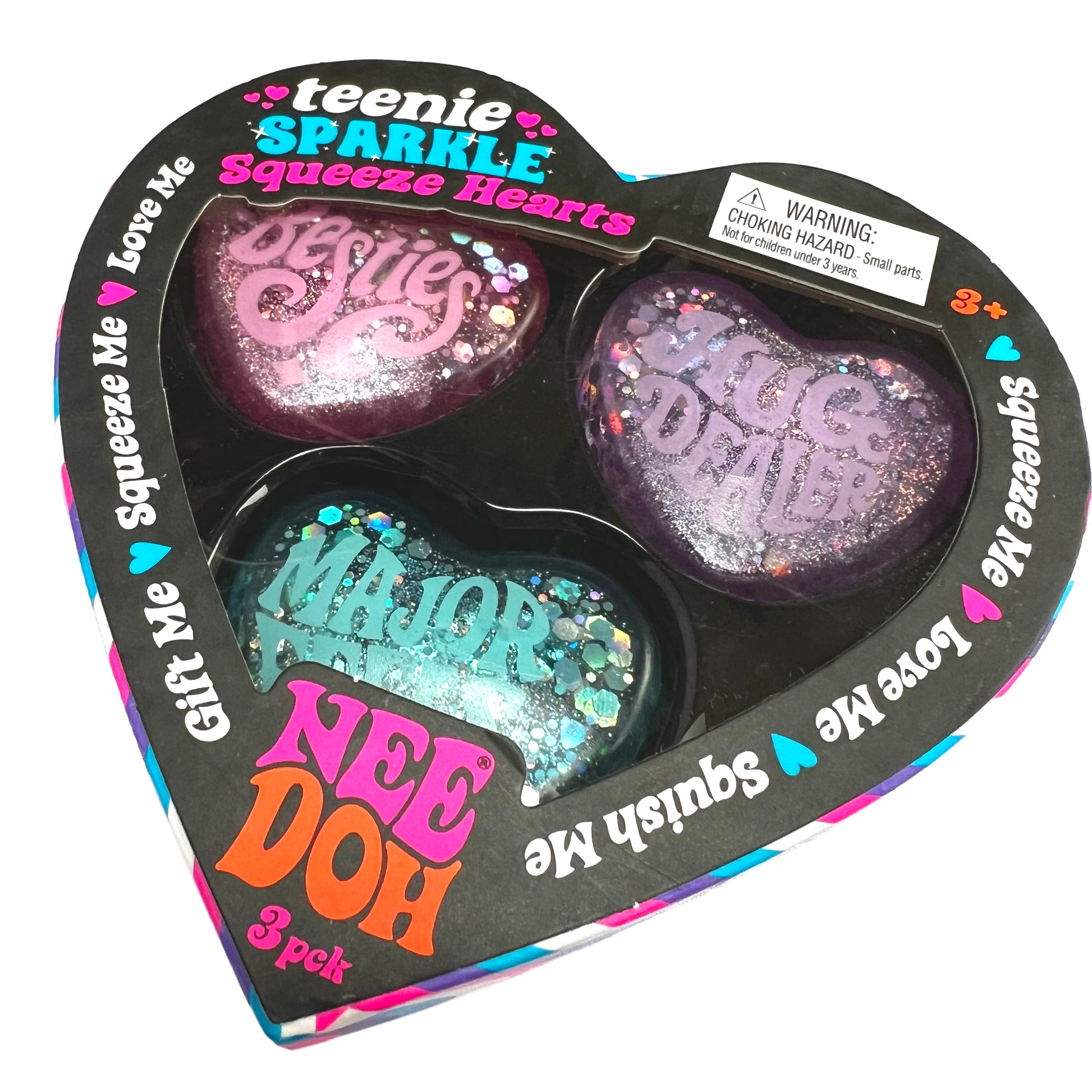 Heart-shaped packaging of 'teenie SPARKLE Squeeze Hearts' with colorful text and glittery hearts.