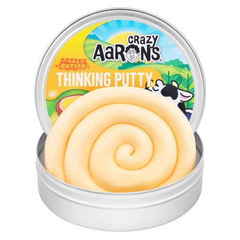 Crazy Aaron's Thinking Putty in a metal tin with a yellow lid.